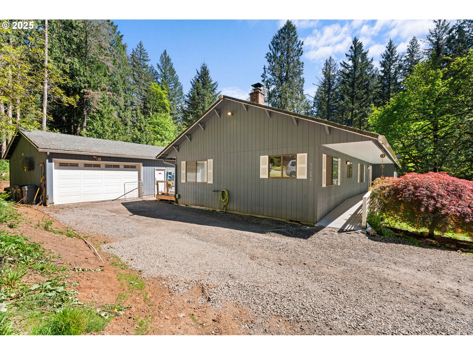 35650 Southeast Barnum Road Sandy, OR 97055 - Photo 3 of 35 a front view of a house with a yard and garage