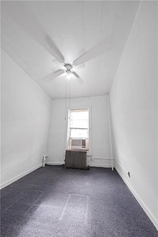 968 St Johns Place Brooklyn, NY 11213 - Photo 8 of 20 an empty room with a chandelier fan and windows