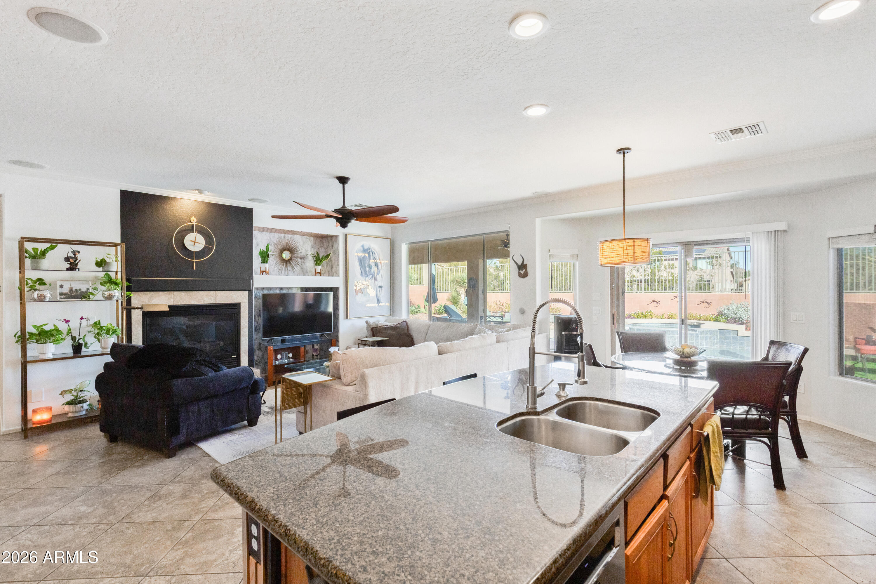 6530 West Bent Tree Drive Phoenix, AZ 85083 - Photo 11 of 42 a kitchen with sink refrigerator and couches