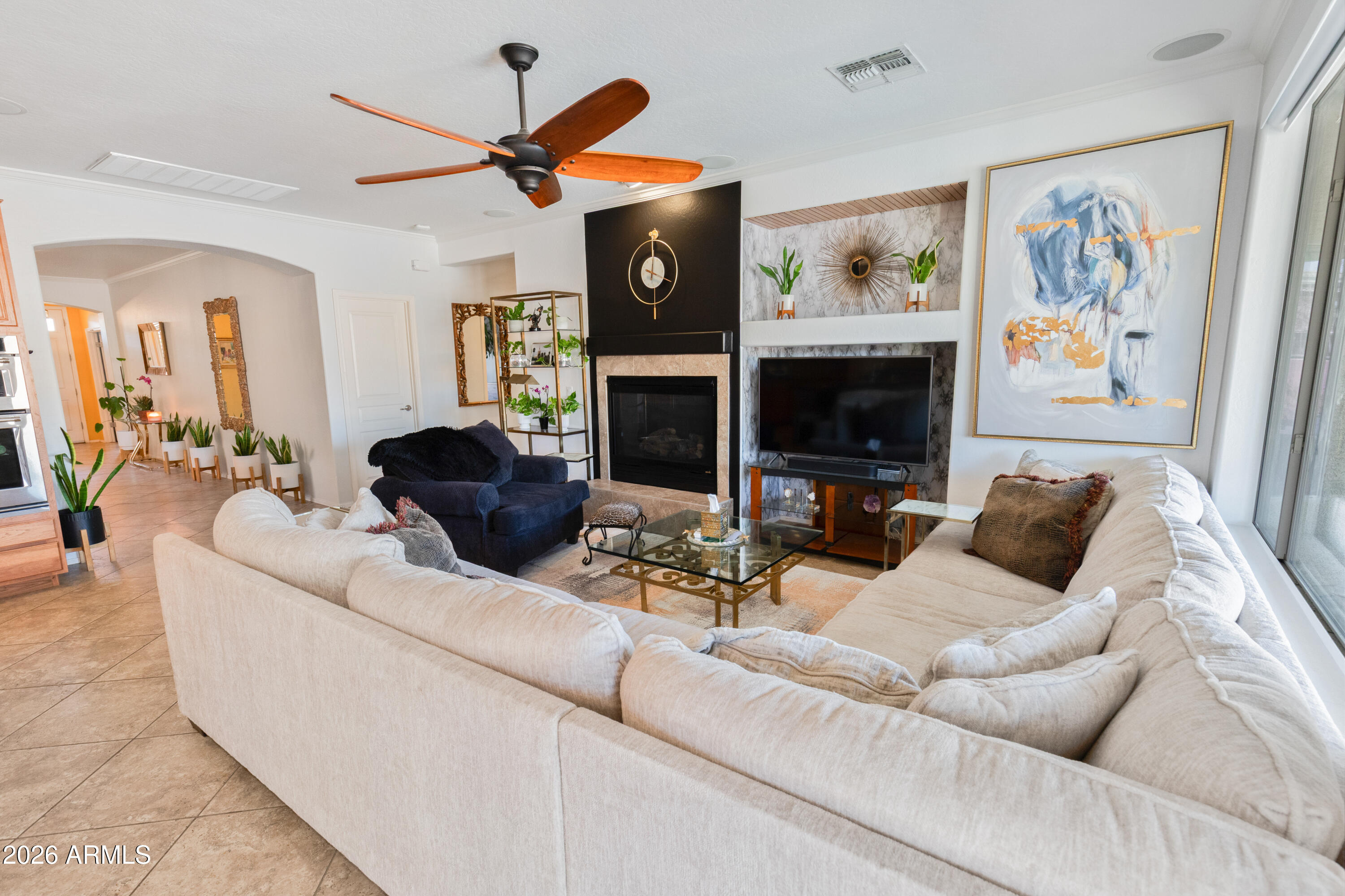 6530 West Bent Tree Drive Phoenix, AZ 85083 - Photo 14 of 42 a living room with fireplace furniture and a flat screen tv