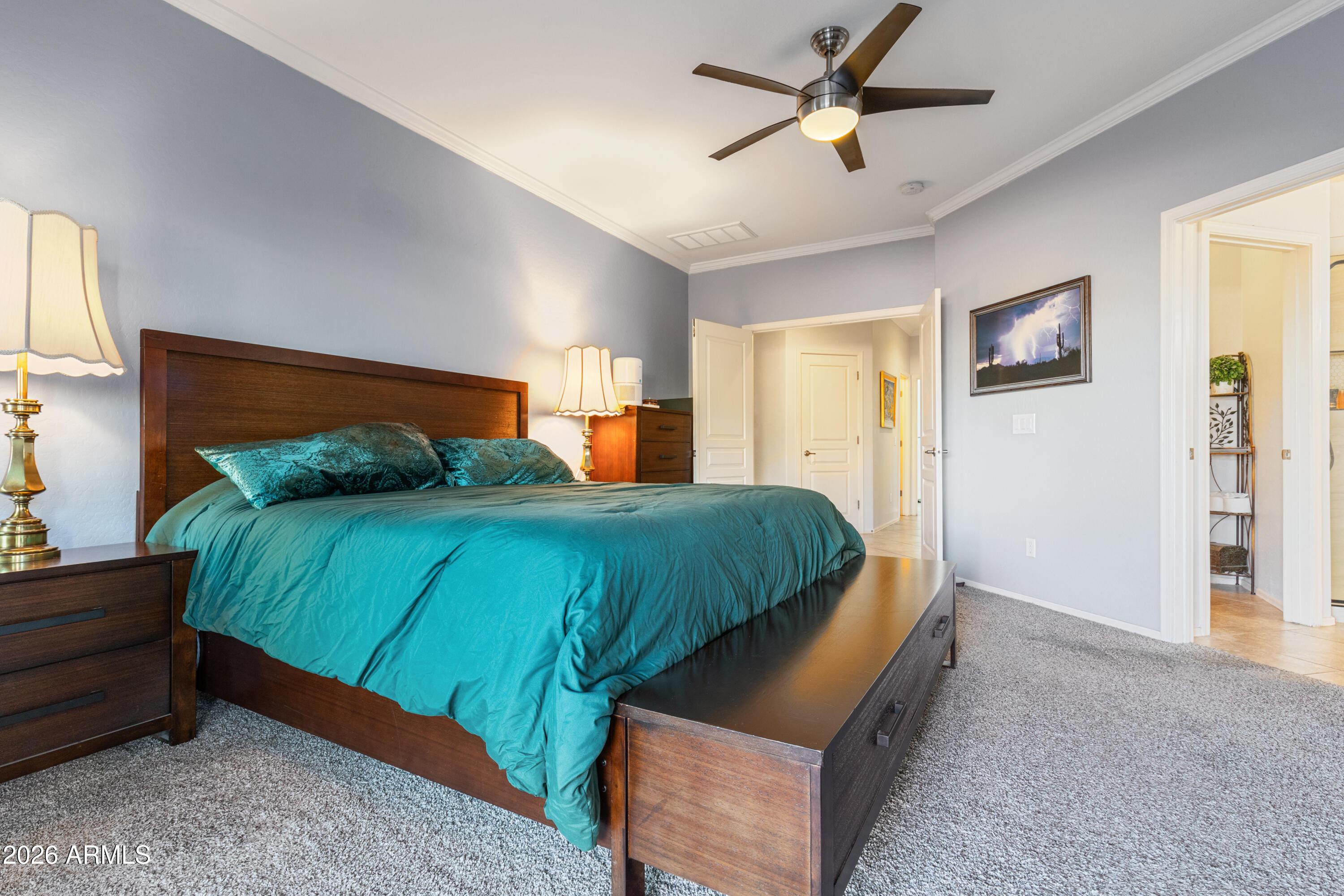 6530 West Bent Tree Drive Phoenix, AZ 85083 - Photo 17 of 42 a bedroom with a bed and a chandelier