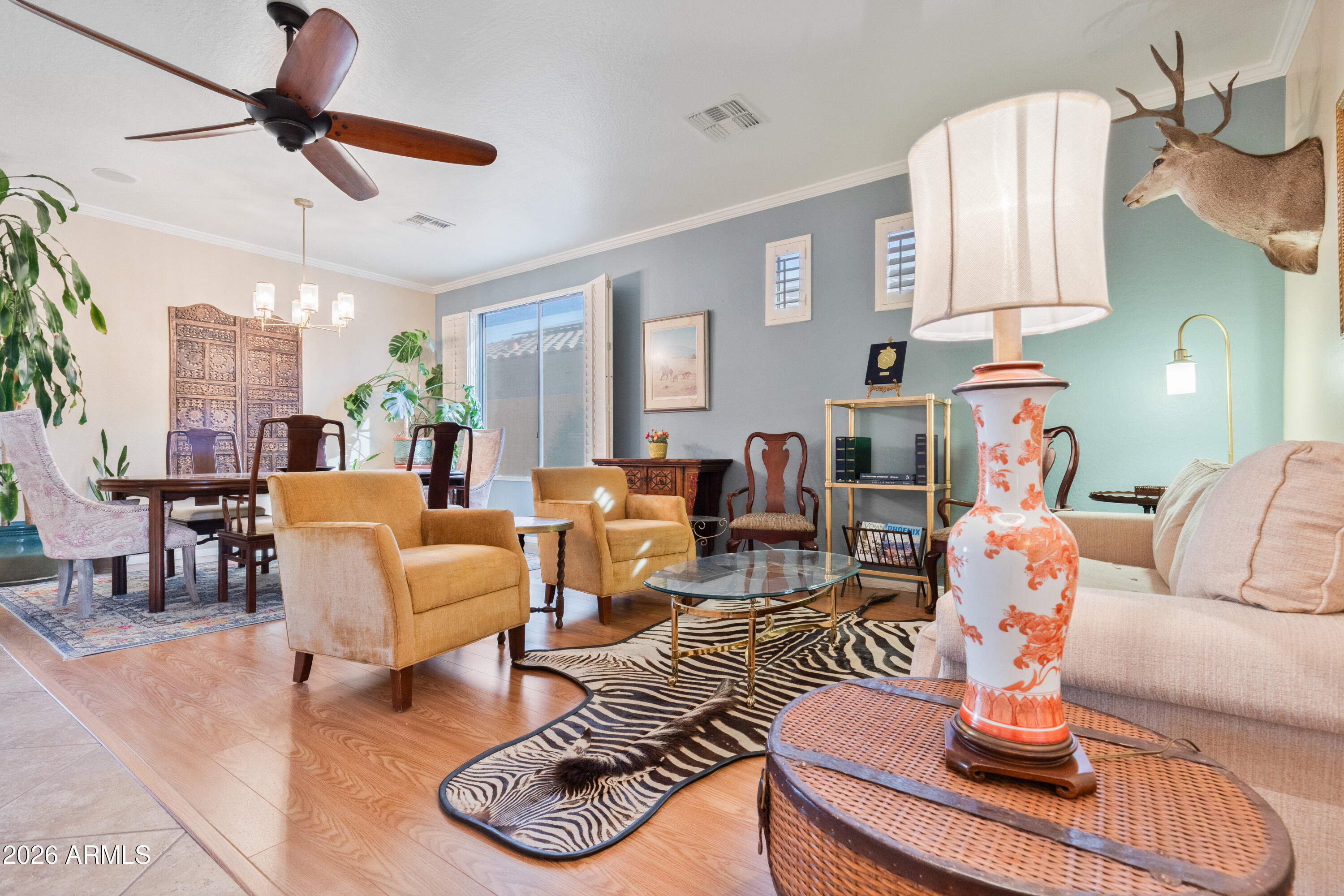 6530 West Bent Tree Drive Phoenix, AZ 85083 - Photo 29 of 42 a living room with furniture or couch and a chandelier