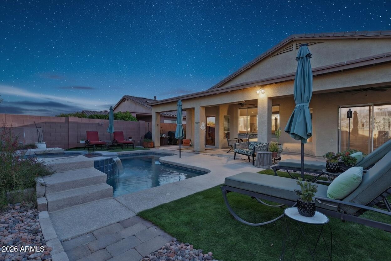 6530 West Bent Tree Drive Phoenix, AZ 85083 - Photo 10 of 42 a view of a patio with couches table and chairs with plants and wooden fence