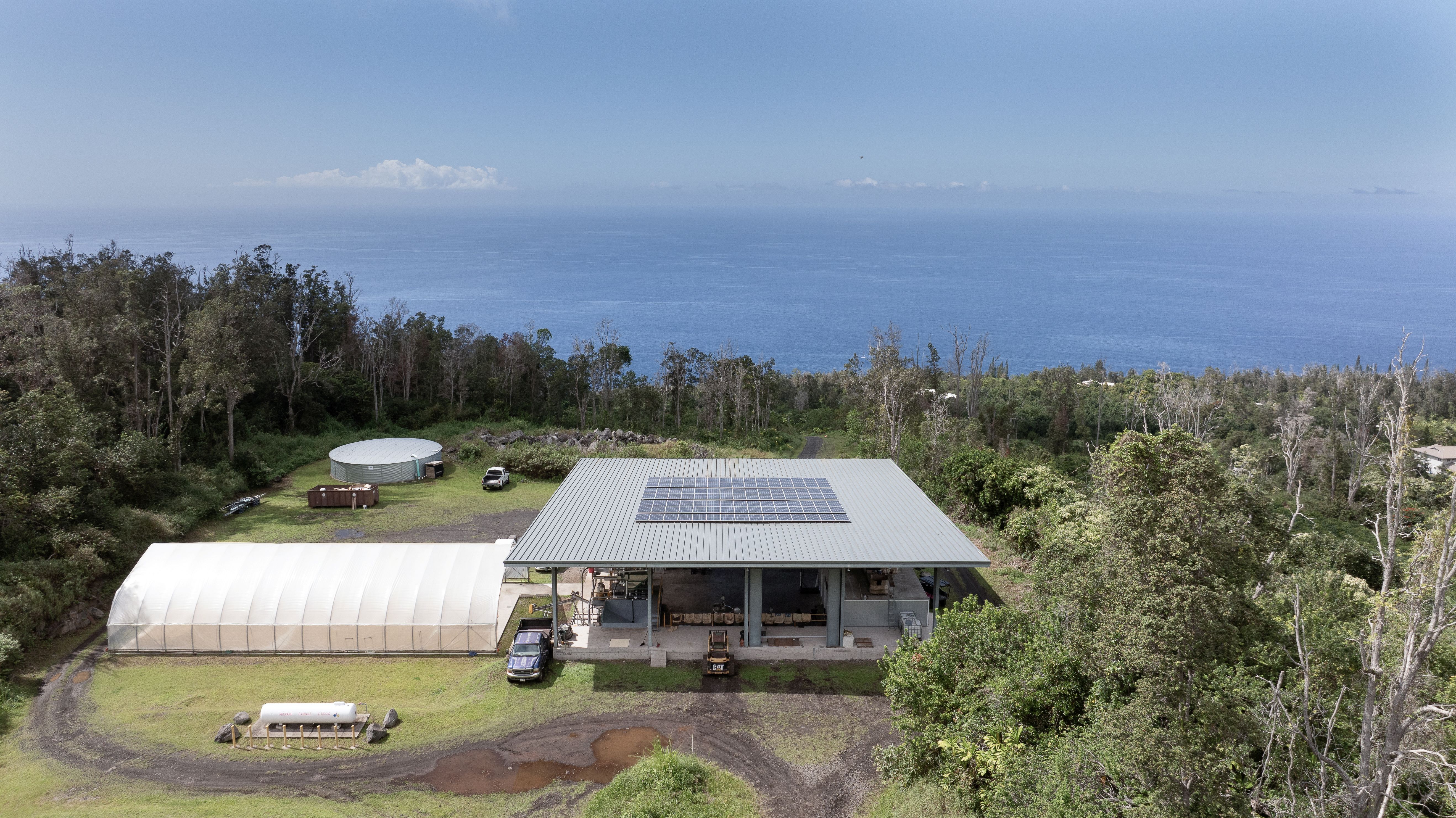 87-2854 Hawaii Belt Road Captain Cook, HI 96704 - Photo 15 of 30 an aerial view of a house with garden space and trees