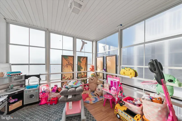 a living room filled with furniture and a chandelier