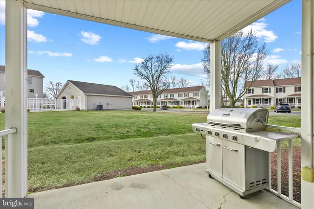 a view of a house with backyard from a kitchen