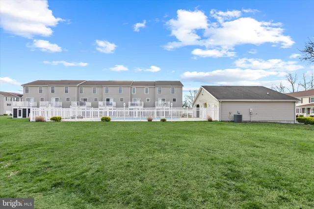 a view of a backyard with plants and a garden