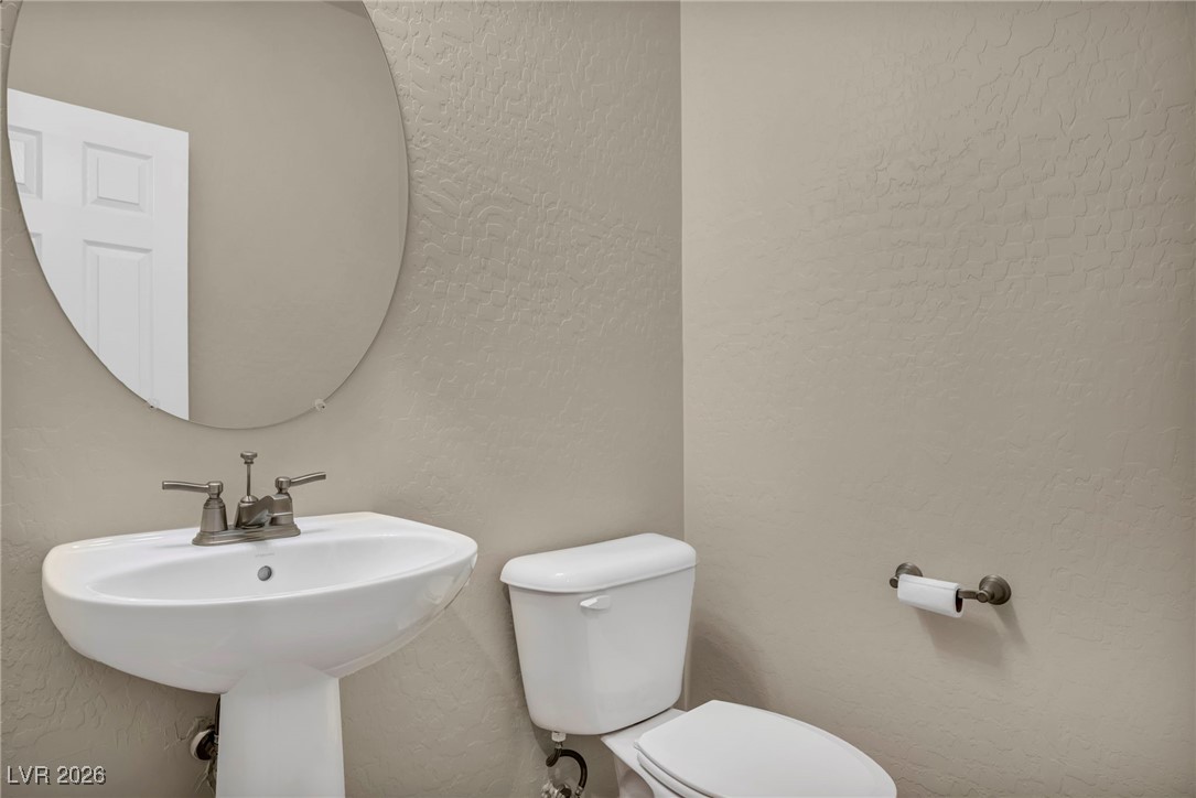 356 Aqua Springs Road Las Vegas, NV 89148 - Photo 32 of 39 Half bath featuring a textured wall