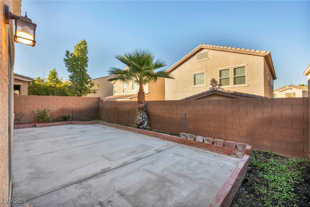 356 Aqua Springs Road Las Vegas, NV 89148 - Photo 35 of 39 Fenced backyard featuring a patio area