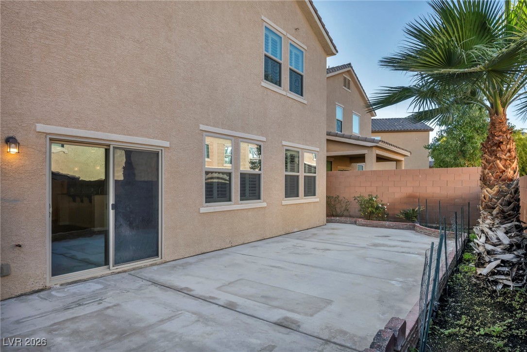 356 Aqua Springs Road Las Vegas, NV 89148 - Photo 36 of 39 Rear view of property with a patio and stucco siding