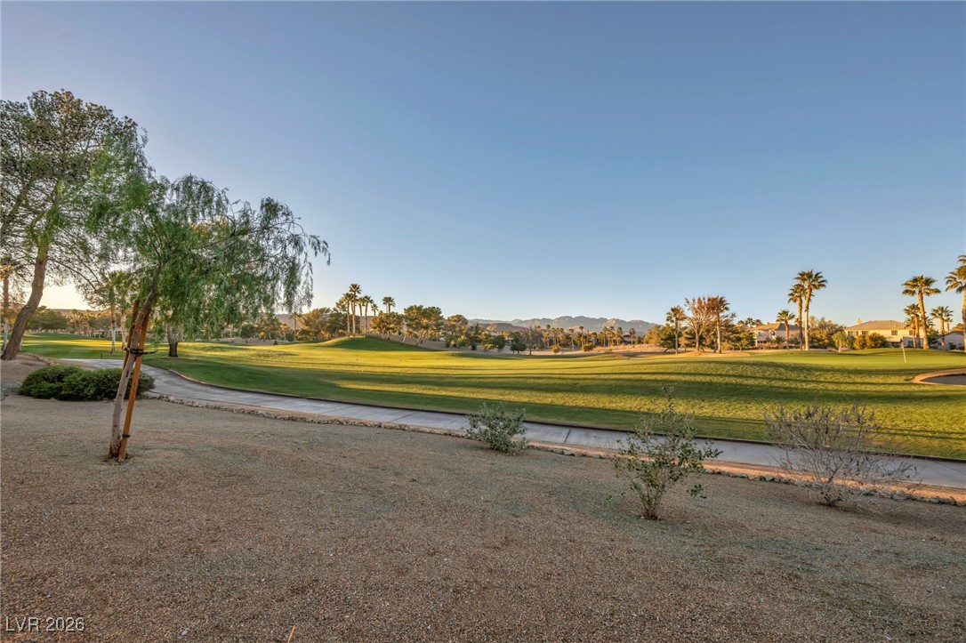 356 Aqua Springs Road Las Vegas, NV 89148 - Photo 39 of 39 View of community featuring view of golf course, a yard, and a mountain view