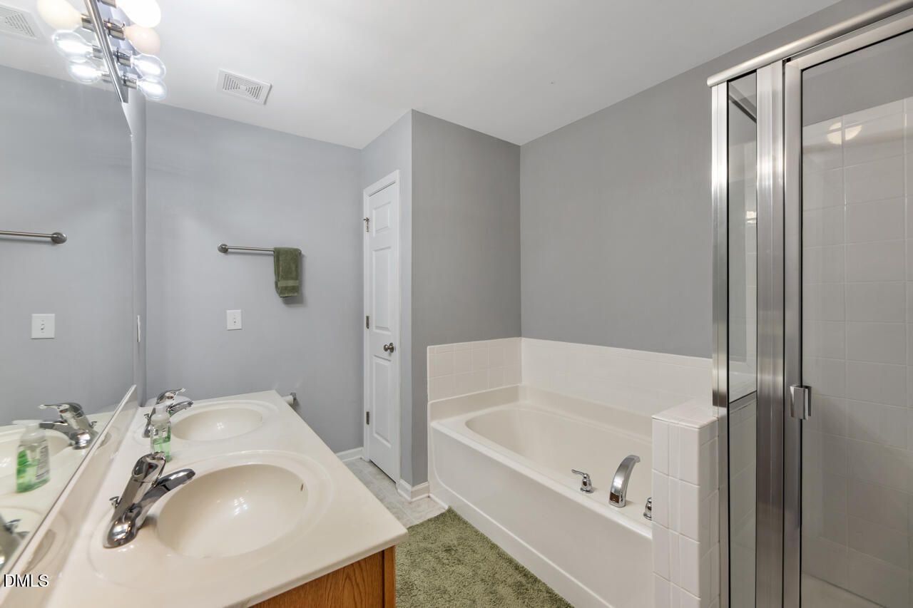 401 Scripps Lane, Unit 104 Raleigh, NC 27610 - Photo 13 of 25 Primary Bathroom