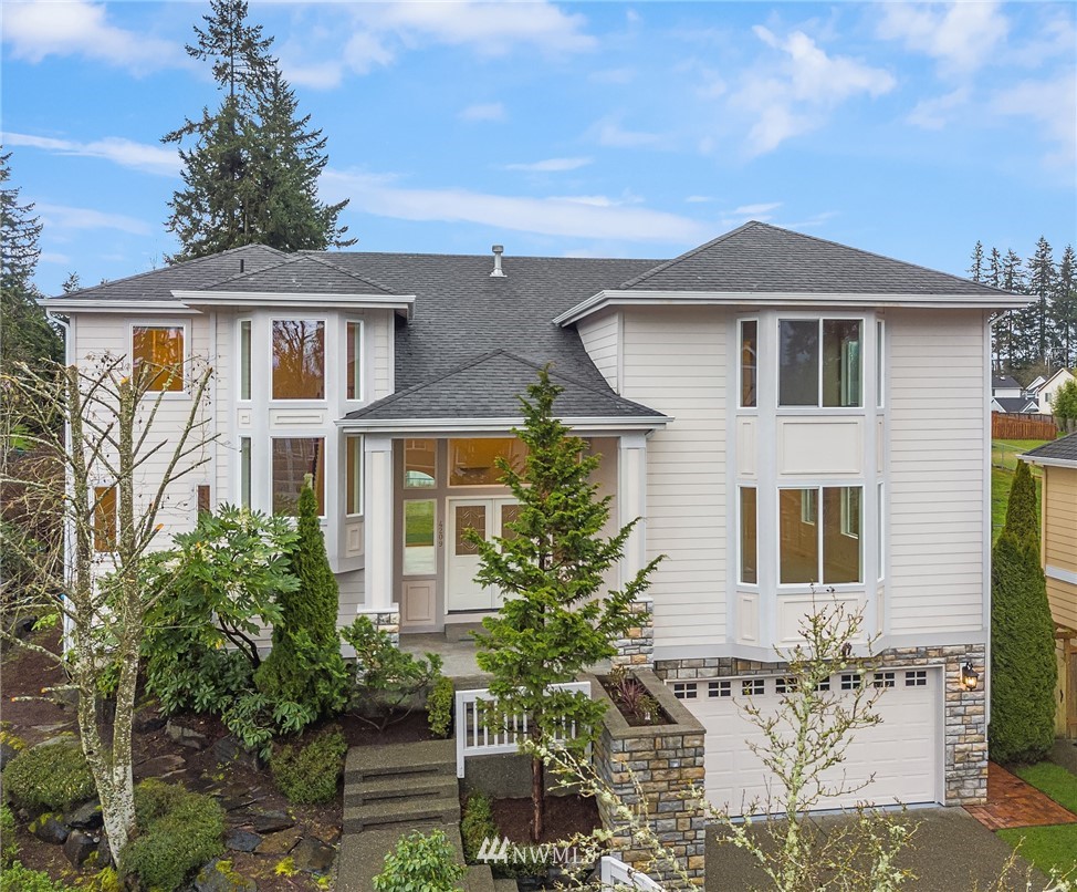 4209 Northeast 27th Place Renton, WA 98059 - Photo 1 of 35 a front view of a house with a yard