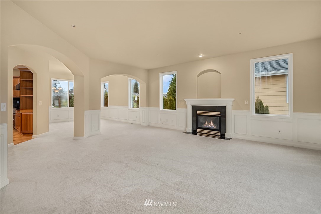 4209 Northeast 27th Place Renton, WA 98059 - Photo 11 of 35 a view of a livingroom with a fireplace and window