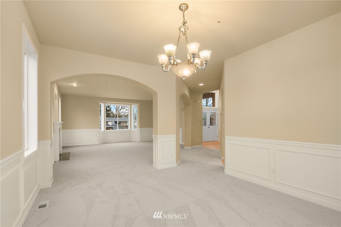 4209 Northeast 27th Place Renton, WA 98059 - Photo 13 of 35 a view of a hallway with chandelier and a chandelier