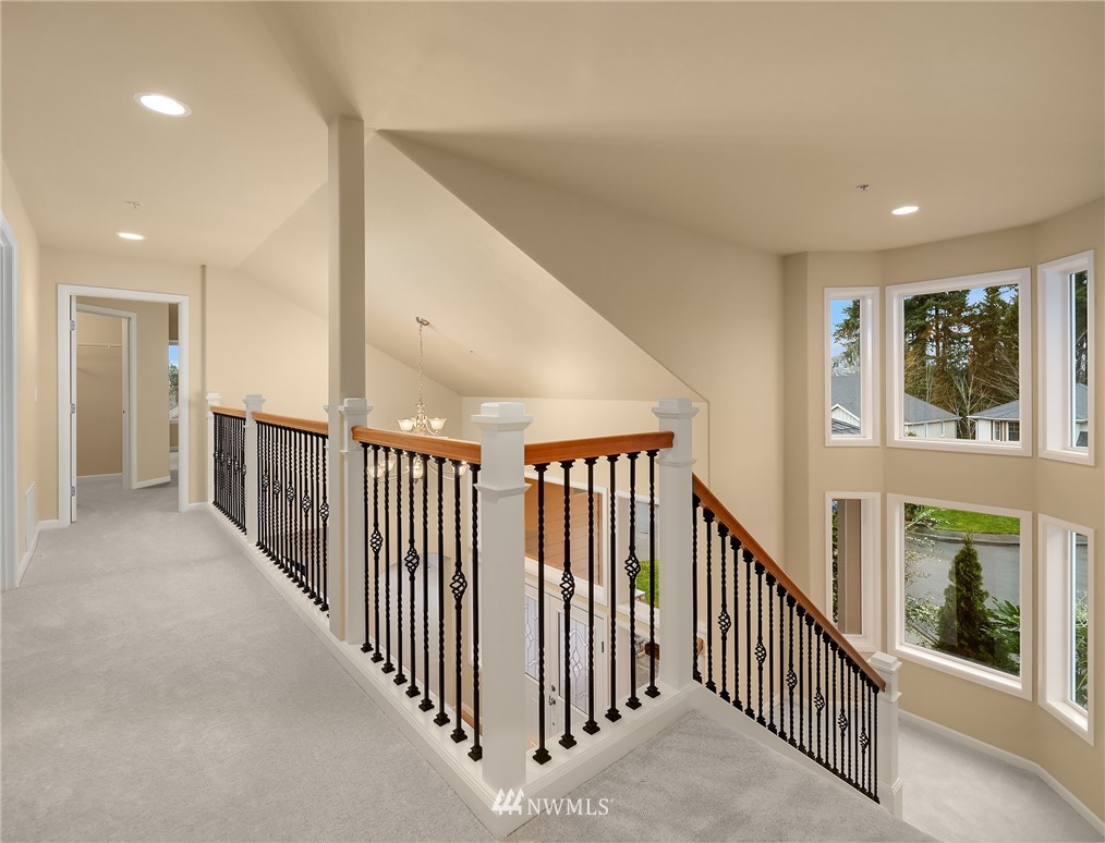 4209 Northeast 27th Place Renton, WA 98059 - Photo 20 of 35 a view of a hallway with windows