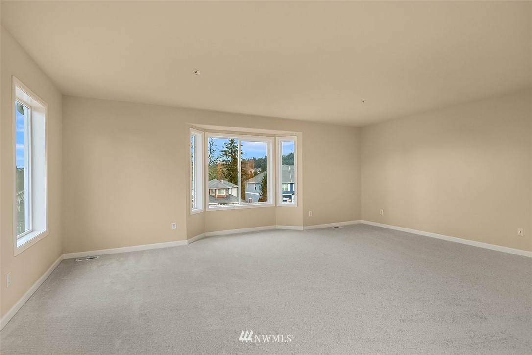 4209 Northeast 27th Place Renton, WA 98059 - Photo 22 of 35 an empty room with windows