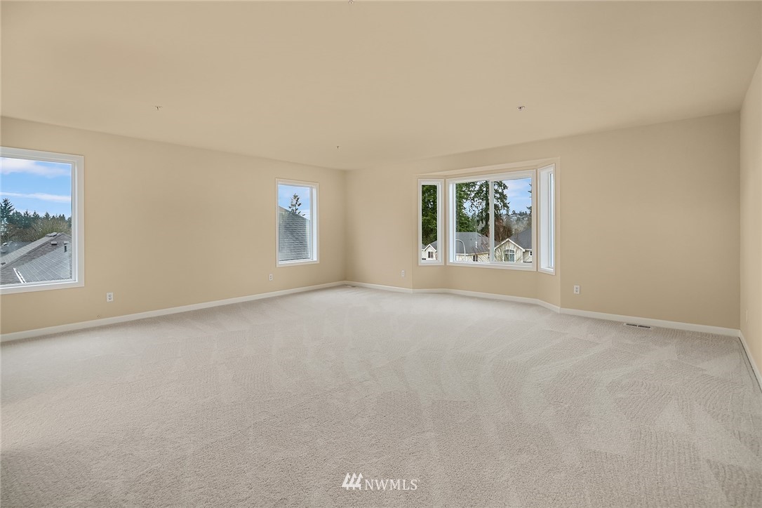 4209 Northeast 27th Place Renton, WA 98059 - Photo 23 of 35 an empty room with windows and closet