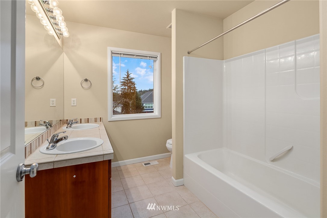 4209 Northeast 27th Place Renton, WA 98059 - Photo 28 of 35 a bathroom with a sink and a mirror