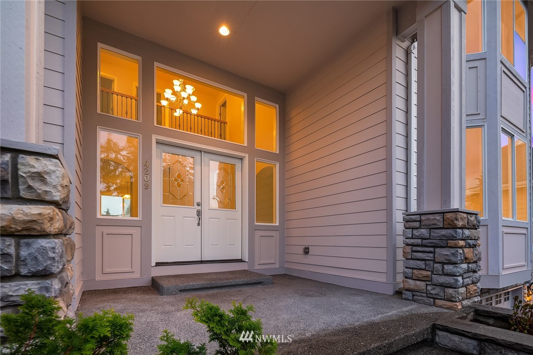 4209 Northeast 27th Place Renton, WA 98059 - Photo 4 of 35 a view of front door of house and yard