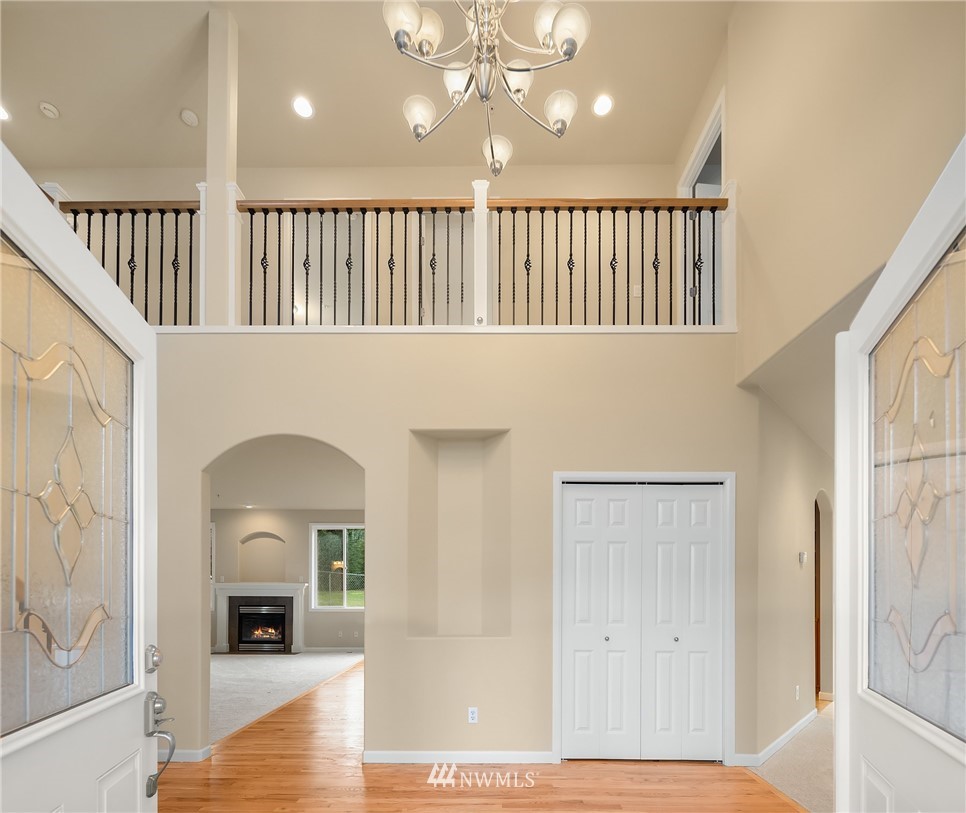 4209 Northeast 27th Place Renton, WA 98059 - Photo 6 of 35 a view of a livingroom with wooden floor and staircase