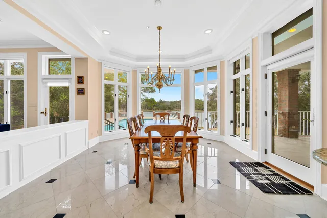 a living room with furniture a ceiling fan and a rug