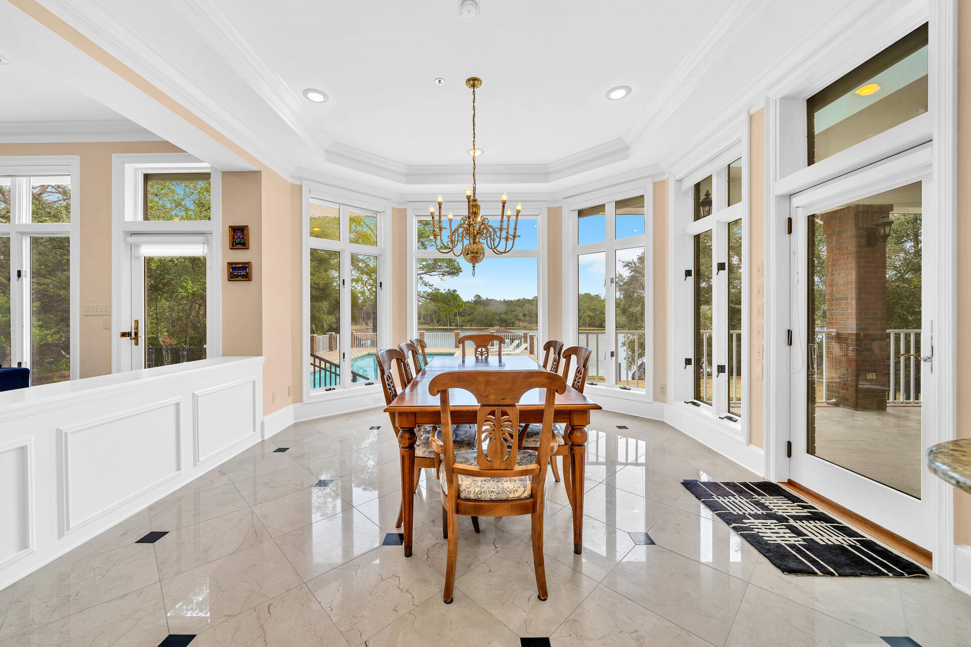 35 Poquito Road Shalimar, FL 32579 - Photo 15 of 87 a dining room with furniture a chandelier and wooden floor