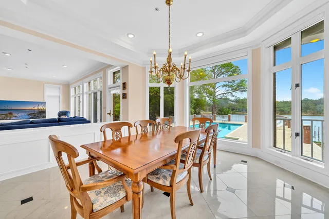 a living room with furniture fireplace and a large window