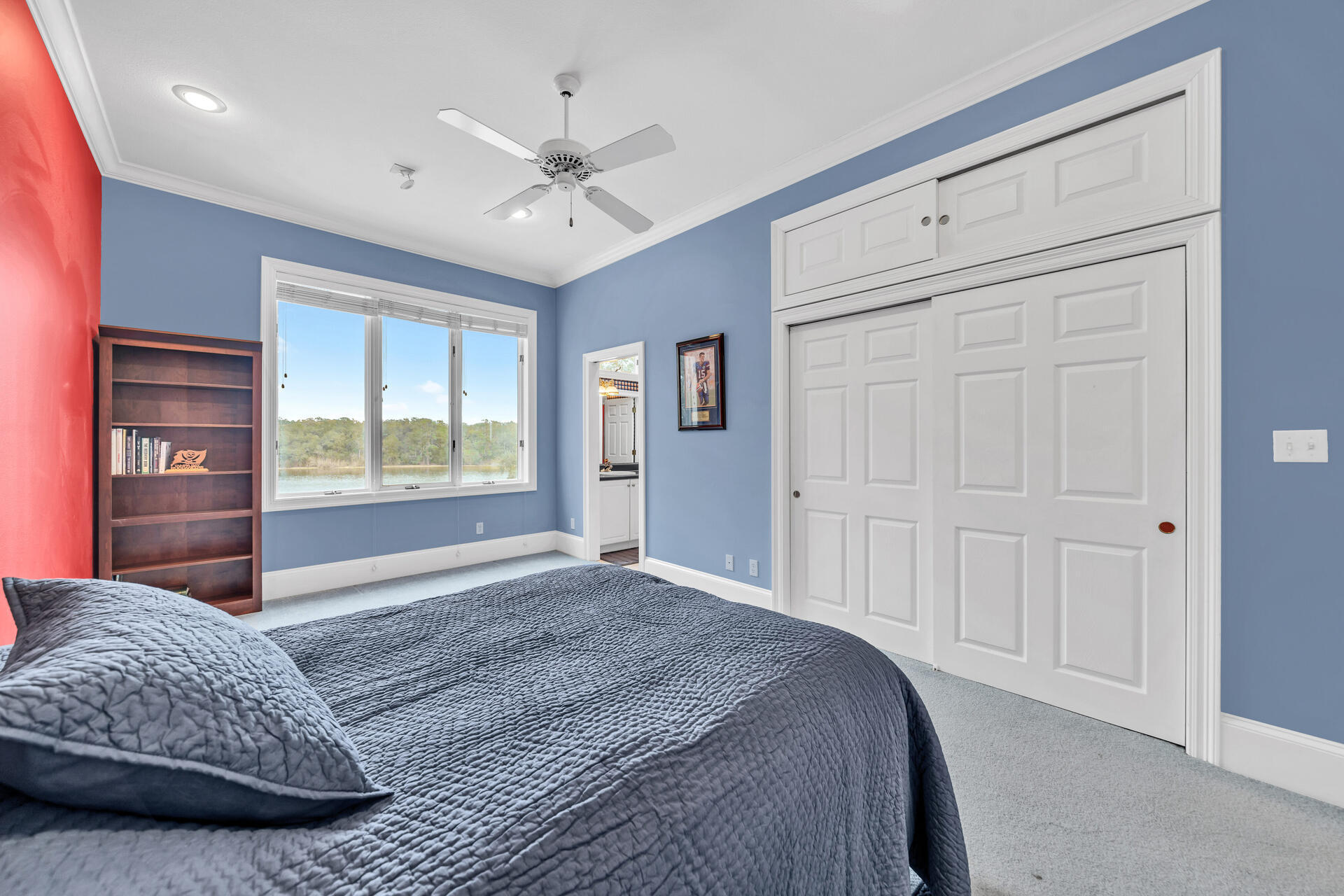 35 Poquito Road Shalimar, FL 32579 - Photo 42 of 87 a bedroom with a large bed and a chandelier