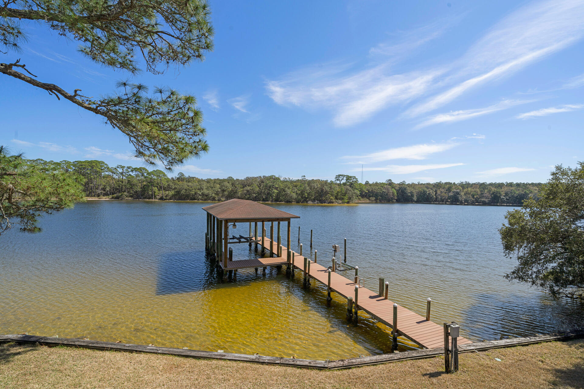 35 Poquito Road Shalimar, FL 32579 - Photo 74 of 87 a view of a lake with a house in the background