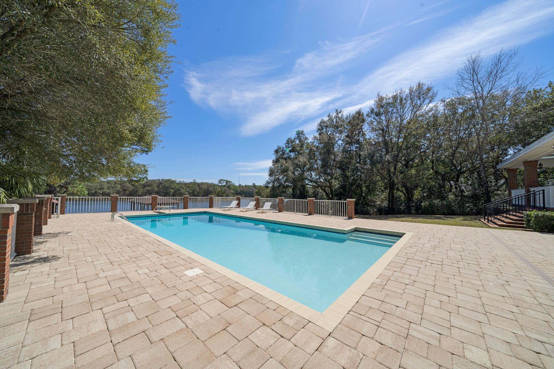 35 Poquito Road Shalimar, FL 32579 - Photo 78 of 87 a view of a swimming pool and lounge chair