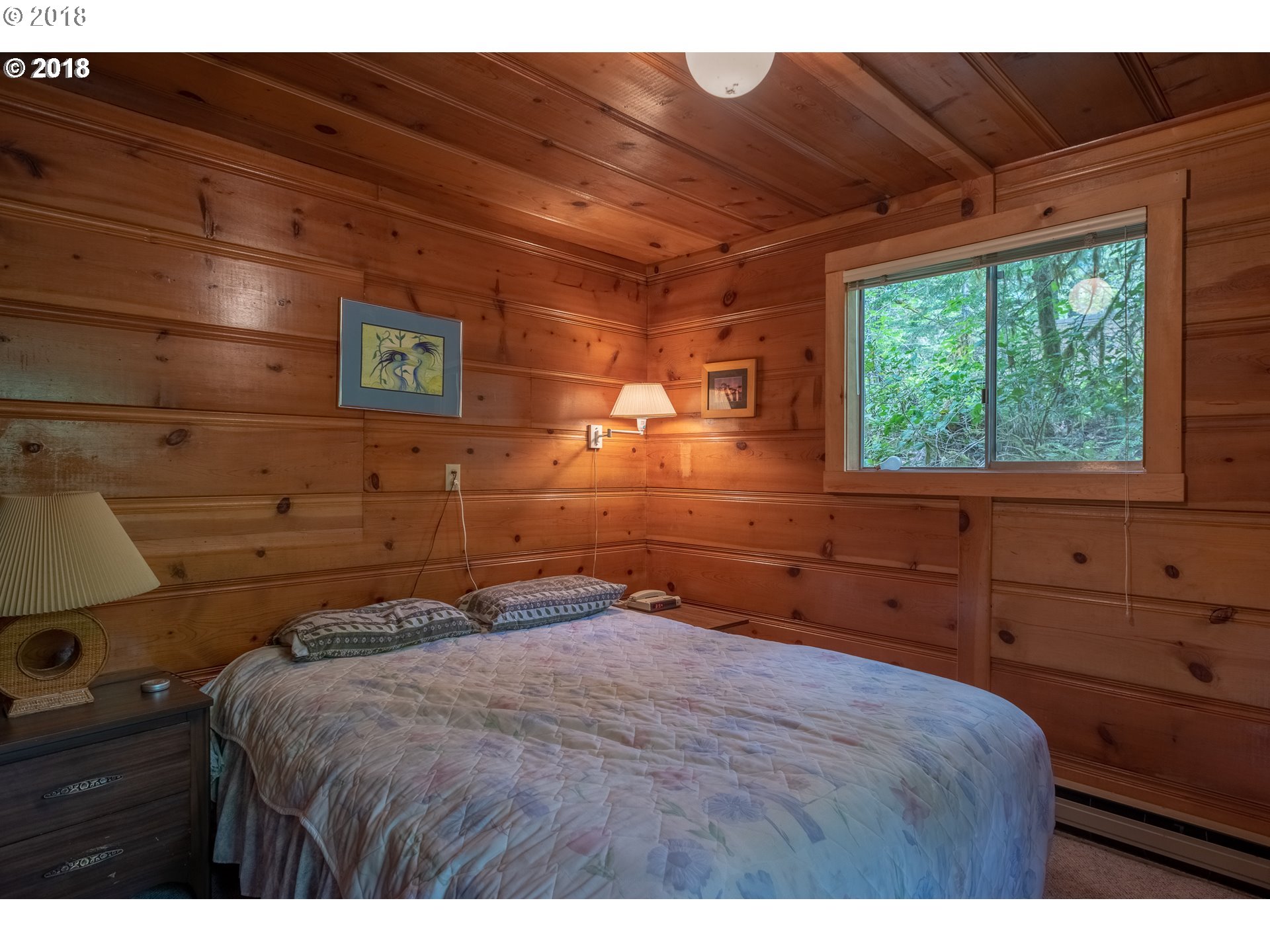 74856 Road 26, Unit 44 Rhododendron, OR 97049 - Photo 20 of 28 a bedroom with a bed and a window