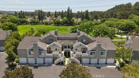 an aerial view of a house with a garden and plants