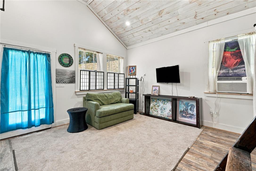 1255 Clearview Road Coplay, PA 18037 - Photo 43 of 54 Whitewashed wood plank ceilings and mixed flooring ground this versatile living space.