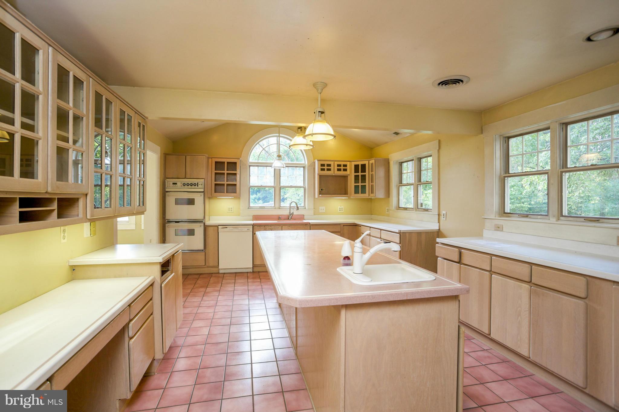 1730 Carrs Mill Road Fallston, MD 21047 - Photo 14 of 29 a large white kitchen with a large window and stainless steel appliances
