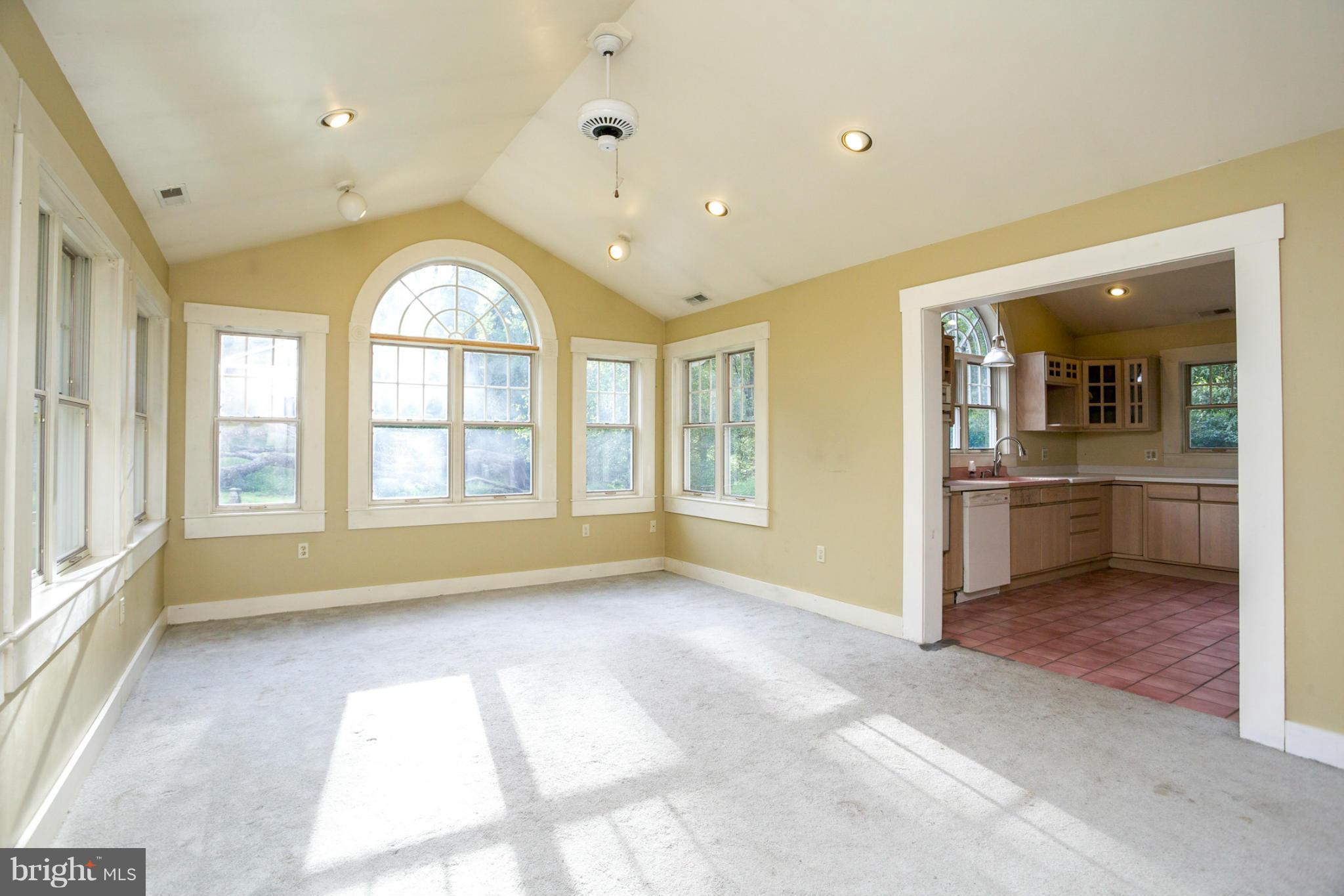 1730 Carrs Mill Road Fallston, MD 21047 - Photo 6 of 29 a view of an empty room with a window and a kitchen
