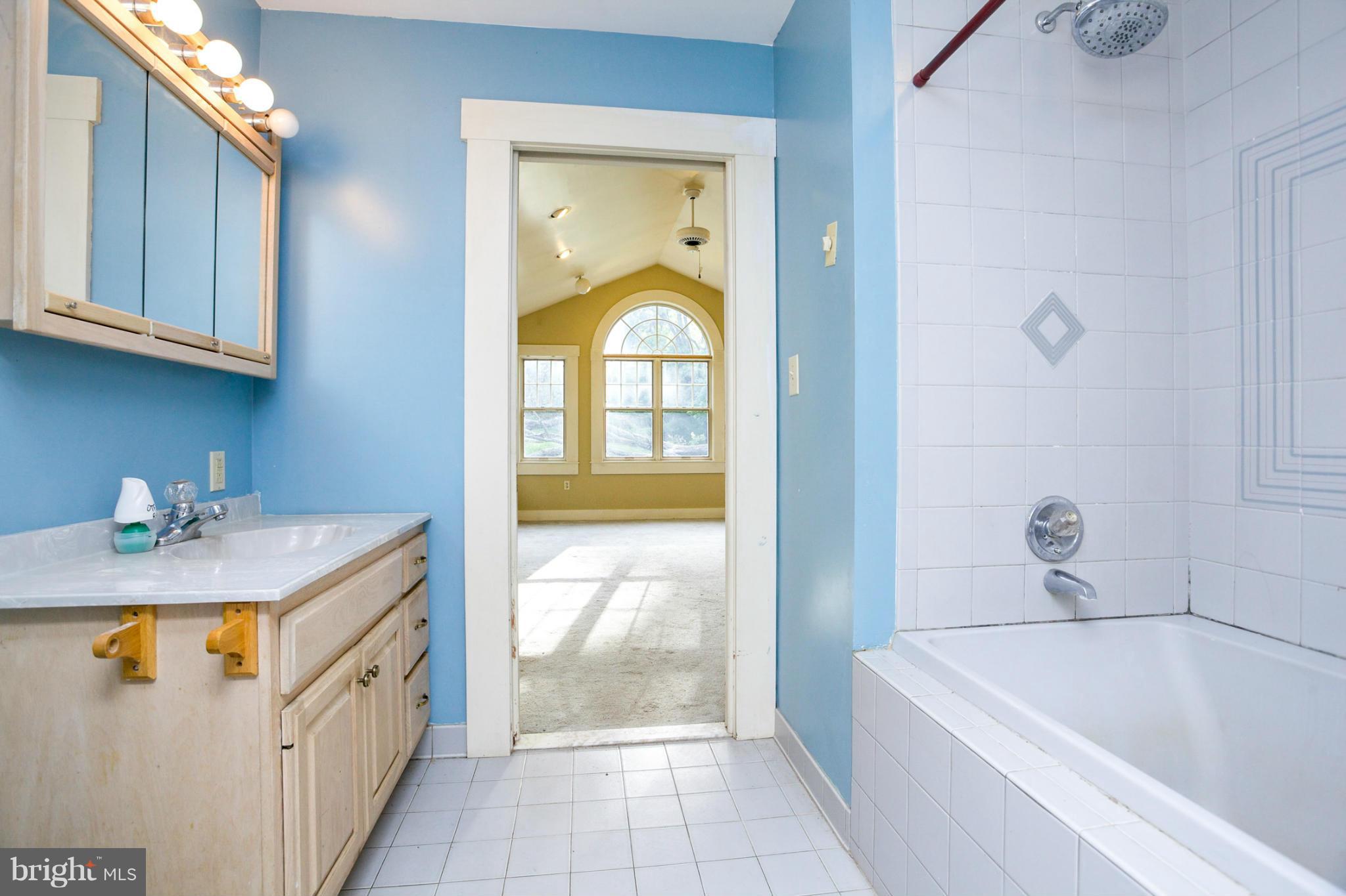 1730 Carrs Mill Road Fallston, MD 21047 - Photo 8 of 29 a bathroom with a granite countertop sink a toilet and bathtub