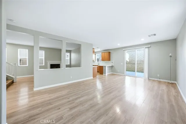a view of a kitchen with a sink and cabinets