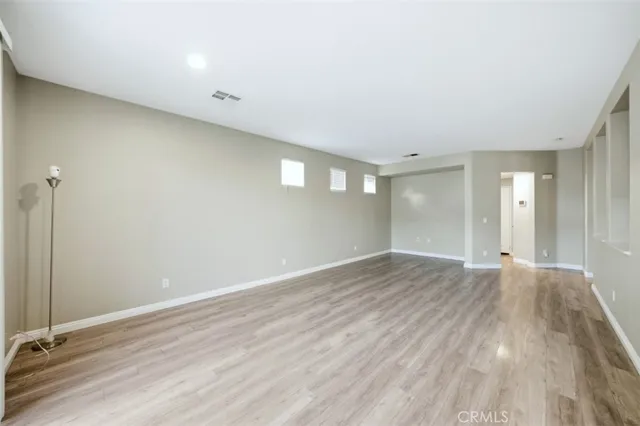 a kitchen with stainless steel appliances a refrigerator sink and wooden cabinets