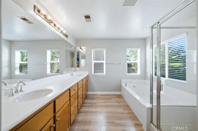 a bathroom with a bathtub and a shower