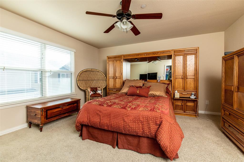 3118 Bedford Road Bedford, TX 76021 - Photo 18 of 29 Carpeted bedroom featuring a ceiling fan with integrated lighting, window with blinds, and neutral wall paint