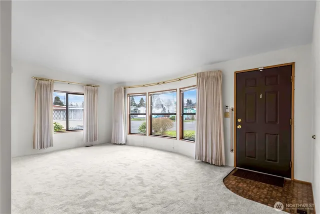 an empty room with windows