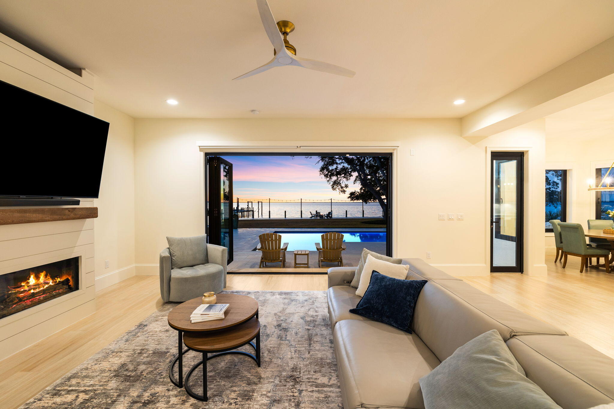 253 Driftwood Point Road Santa Rosa Beach, FL 32459 - Photo 11 of 109 a living room with fireplace furniture and a flat screen tv