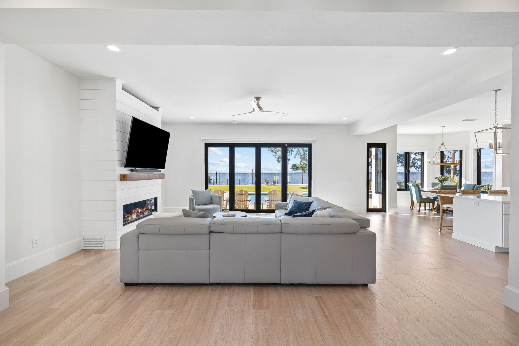 253 Driftwood Point Road Santa Rosa Beach, FL 32459 - Photo 13 of 109 a living room with couches and a flat screen tv