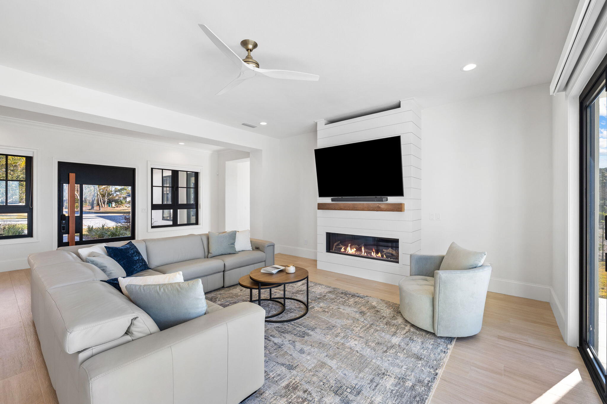 253 Driftwood Point Road Santa Rosa Beach, FL 32459 - Photo 16 of 109 a living room with furniture and a flat screen tv