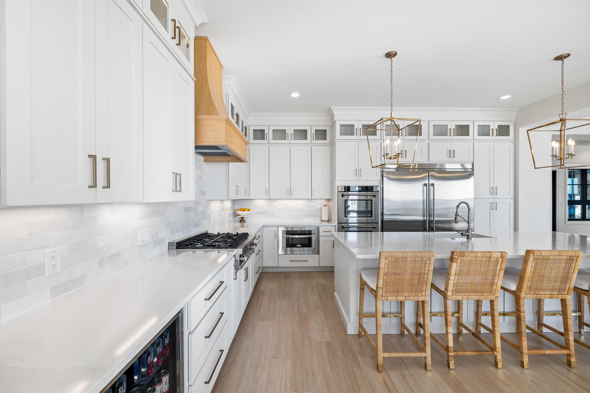 253 Driftwood Point Road Santa Rosa Beach, FL 32459 - Photo 22 of 109 a kitchen with stainless steel appliances kitchen island granite countertop a table chairs and a wooden floor