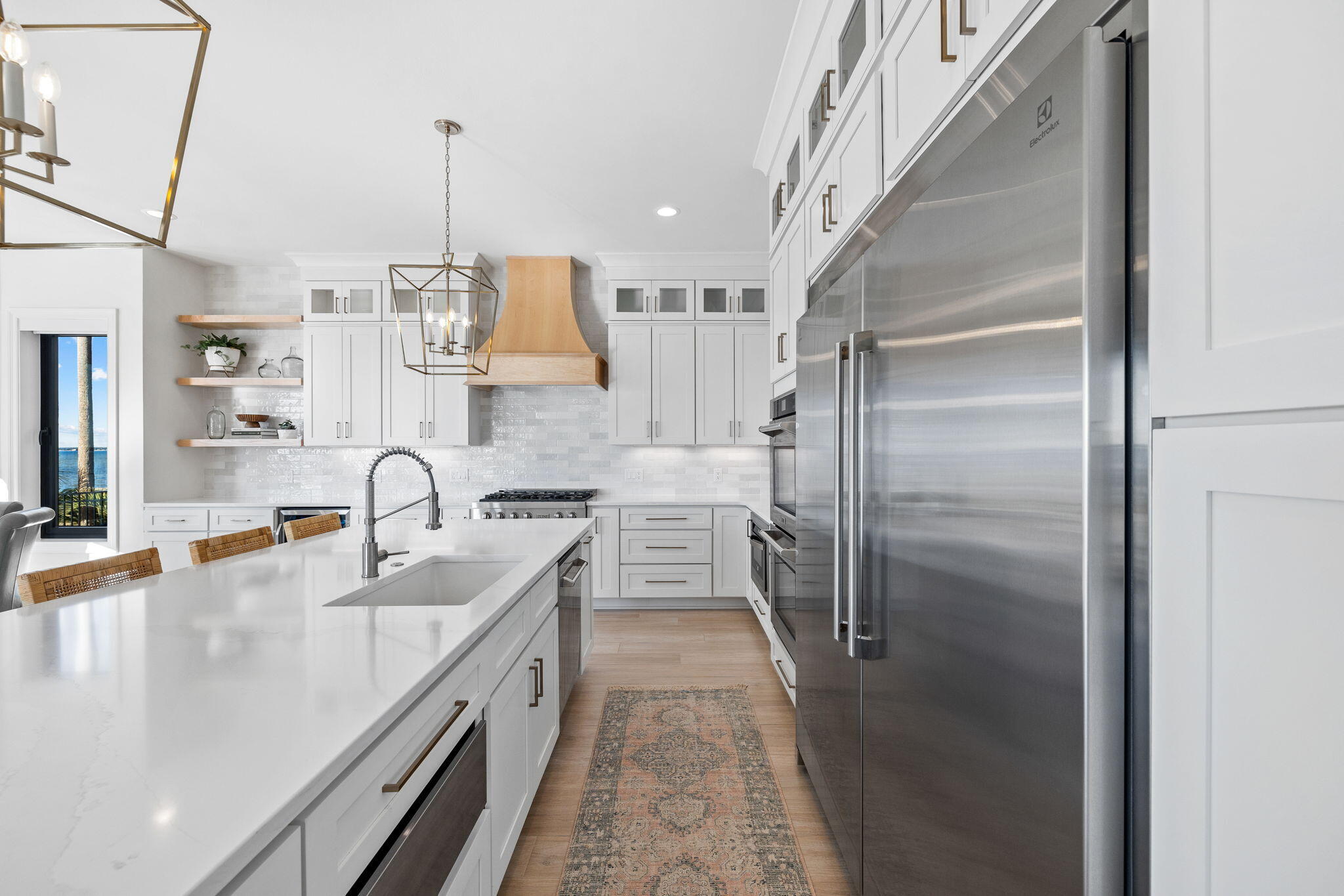 253 Driftwood Point Road Santa Rosa Beach, FL 32459 - Photo 23 of 109 a kitchen with stainless steel appliances granite countertop a sink a stove and a refrigerator