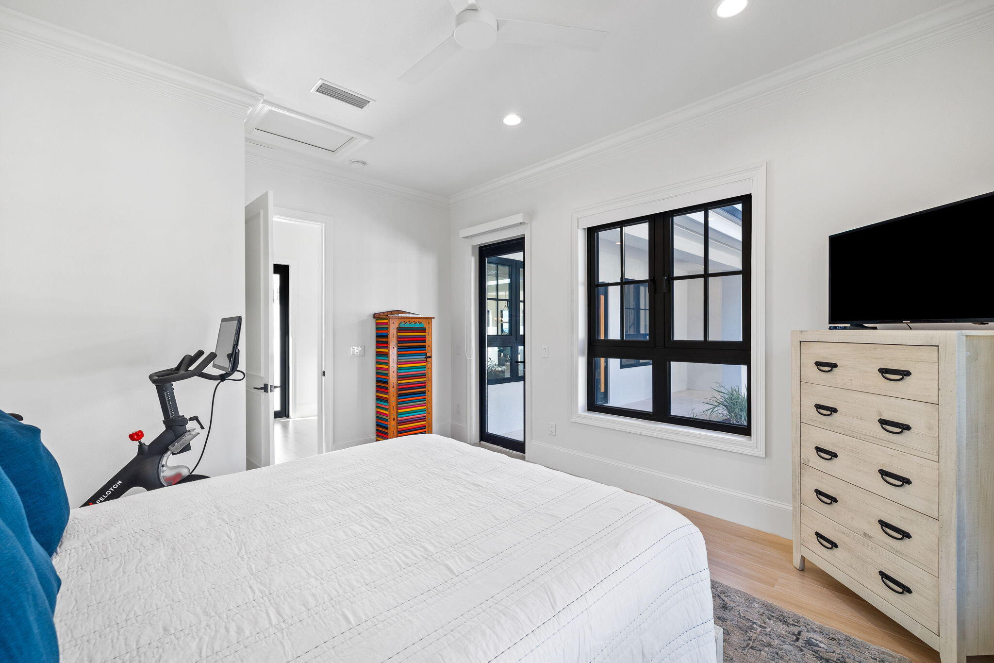 253 Driftwood Point Road Santa Rosa Beach, FL 32459 - Photo 30 of 109 a bedroom with a bed and a flat tv screen on dresser