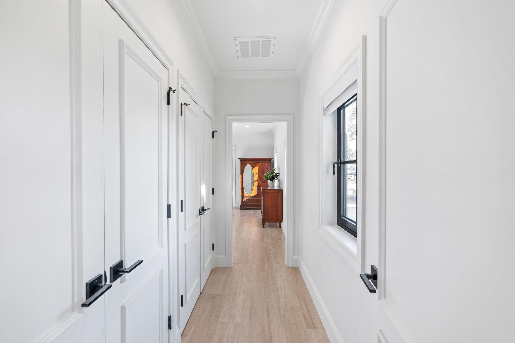 253 Driftwood Point Road Santa Rosa Beach, FL 32459 - Photo 36 of 109 a view of a hallway with wooden floor and closet