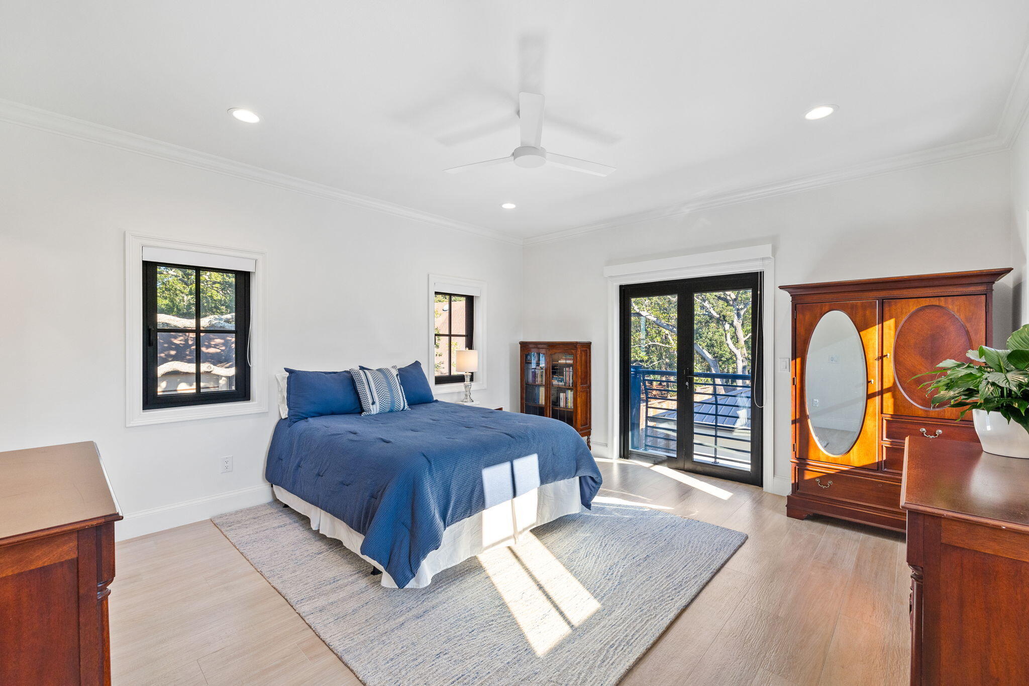 253 Driftwood Point Road Santa Rosa Beach, FL 32459 - Photo 37 of 109 a bedroom with a balcony a bed and dresser with wooden floor